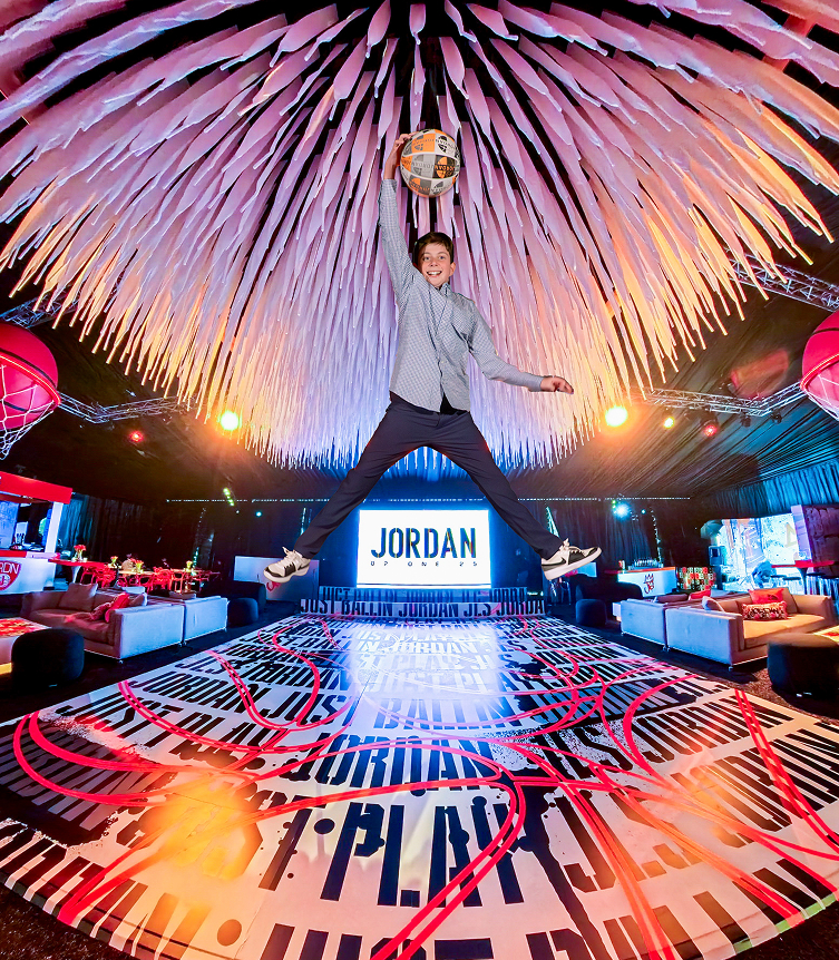 Boy slamming a high dunk at his Bat Mitzvah